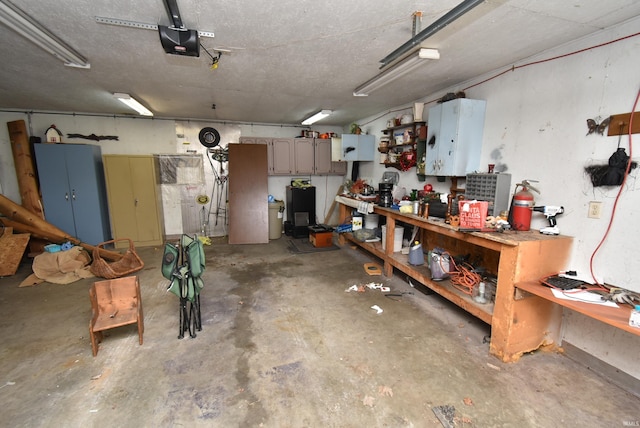 102 S Foster St, Boswell, IN 47921 - garage featuring a garage door opener and a workshop area
