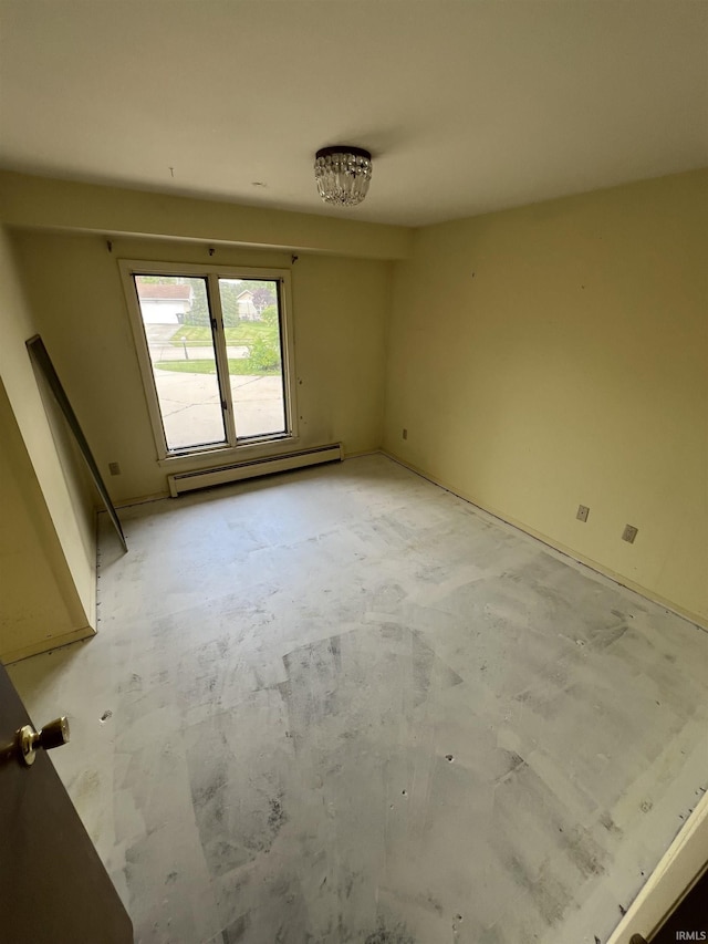 3215 Wakashan Pl, Fort Wayne, IN 46815 - spare room featuring a baseboard radiator and unfinished concrete flooring