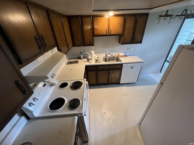 3215 Wakashan Pl, Fort Wayne, IN 46815 - kitchen featuring white appliances, concrete floors, light countertops, and dark brown cabinets