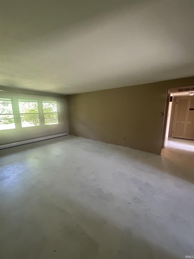 3215 Wakashan Pl, Fort Wayne, IN 46815 - unfurnished room featuring baseboard heating and concrete flooring