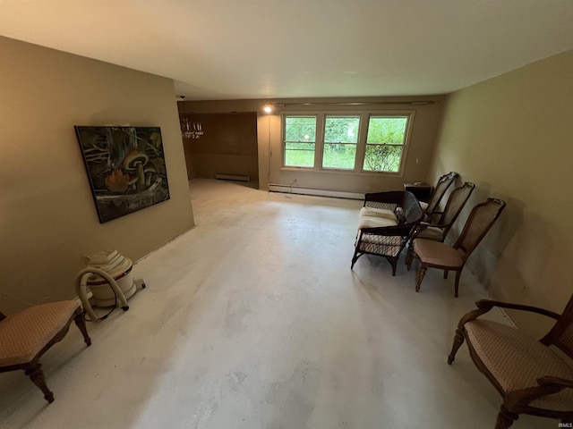 3215 Wakashan Pl, Fort Wayne, IN 46815 - living area with a baseboard radiator, a chandelier, finished concrete floors, and baseboard heating