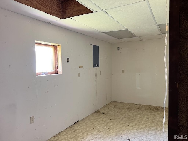 126 E Washington St, Monroe, IN 46772 - spare room with light flooring, electric panel, and a paneled ceiling