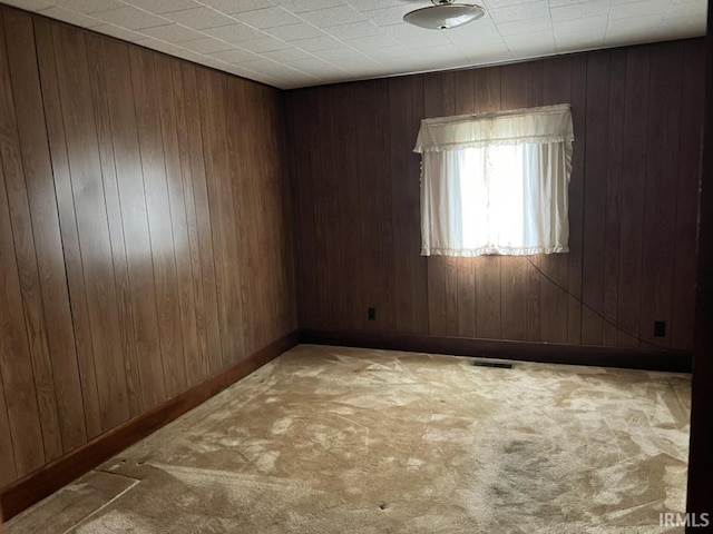 126 E Washington St, Monroe, IN 46772 - spare room with carpet and wood walls