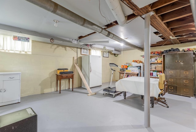 3721 Claremont Ave, Evansville, IN 47712 - basement featuring freestanding refrigerator and concrete block wall