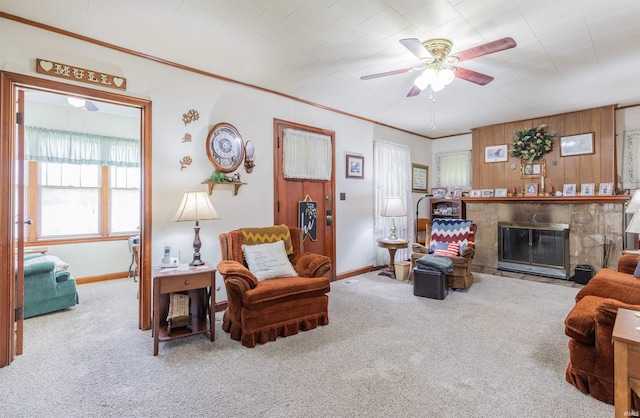 3721 Claremont Ave, Evansville, IN 47712 - living area featuring a ceiling fan, carpet floors, a fireplace with flush hearth, and crown molding