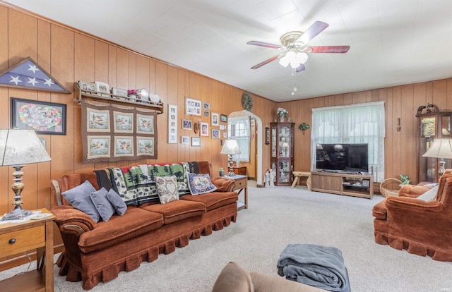 3721 Claremont Ave, Evansville, IN 47712 - carpeted living room with ceiling fan and wood walls