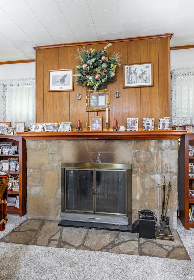 3721 Claremont Ave, Evansville, IN 47712 - detailed view of carpet floors, crown molding, a fireplace, and wood walls
