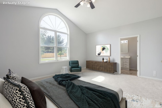 26973 Water Edge Dr, Elkhart, IN 46514 - bedroom featuring lofted ceiling, light carpet, ensuite bath, and ceiling fan