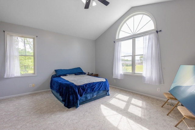 26973 Water Edge Dr, Elkhart, IN 46514 - carpeted bedroom with multiple windows, lofted ceiling, and a ceiling fan