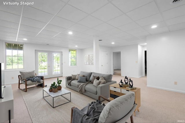 26973 Water Edge Dr, Elkhart, IN 46514 - living area featuring carpet flooring, recessed lighting, plenty of natural light, french doors, and a paneled ceiling