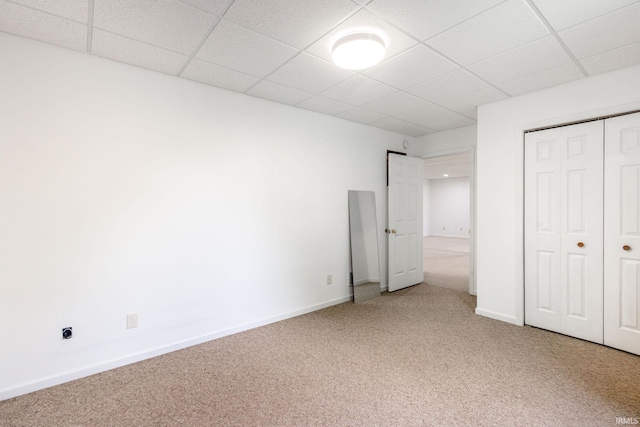 26973 Water Edge Dr, Elkhart, IN 46514 - unfurnished bedroom with light colored carpet, a closet, and a drop ceiling