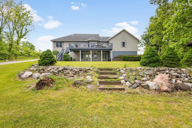 26973 Water Edge Dr, Elkhart, IN 46514 - back of house featuring stairs, a wooden deck, and a lawn