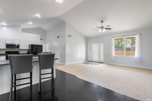 26973 Water Edge Dr, Elkhart, IN 46514 - kitchen featuring stainless steel microwave, black fridge with ice dispenser, range, white cabinetry, and a ceiling fan
