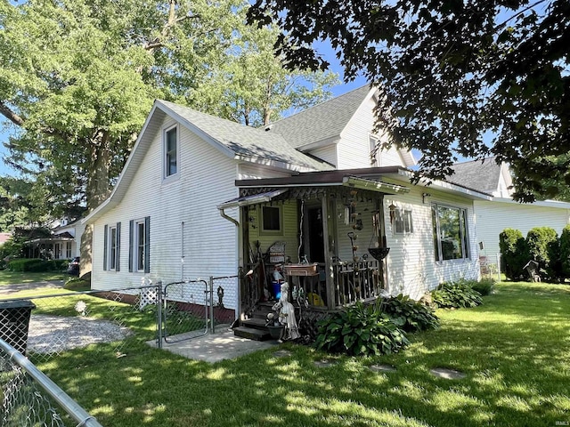 323 Simon St, Plymouth, IN 46563 - back of property featuring a gate, a shingled roof, and a deck