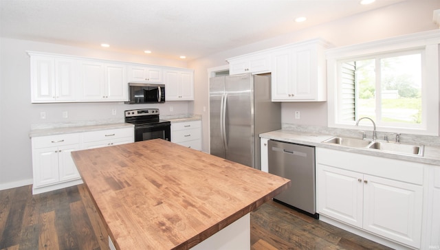 3046 Long Lake Rd, Albion, IN 46701 - kitchen featuring appliances with stainless steel finishes, wood counters, white cabinetry, dark wood-style flooring, and recessed lighting