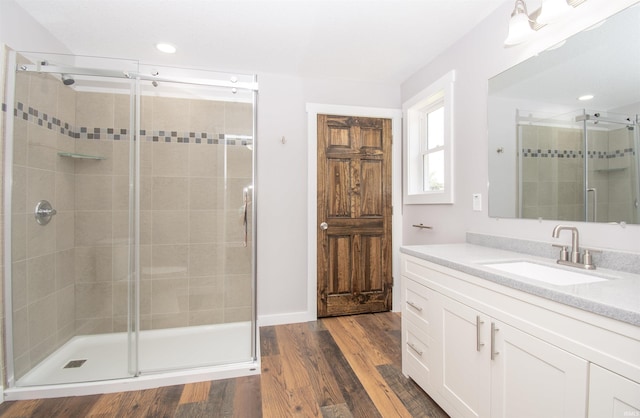 3046 Long Lake Rd, Albion, IN 46701 - bathroom featuring vanity, a shower stall, recessed lighting, and wood finished floors