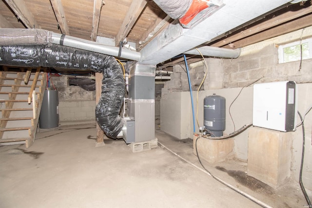 3046 Long Lake Rd, Albion, IN 46701 - basement with a water pressure tank, electric water heater, stairs, and heating unit