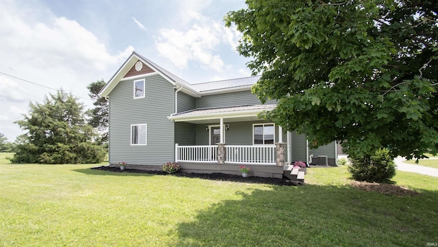 3046 Long Lake Rd, Albion, IN 46701 - view of front of home with covered porch, a front lawn, and a metal roof