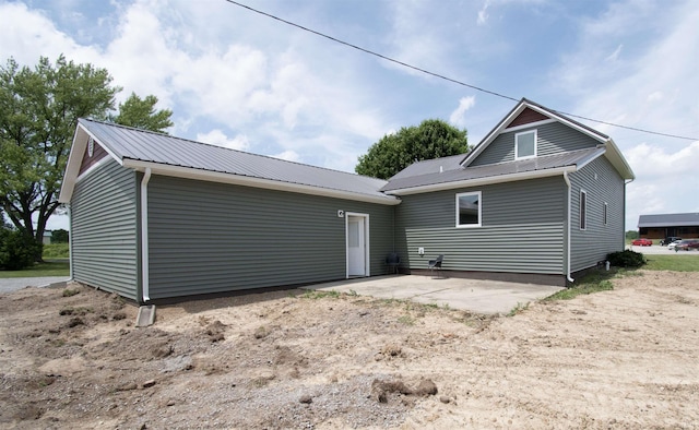 3046 Long Lake Rd, Albion, IN 46701 - back of house with a patio and a metal roof