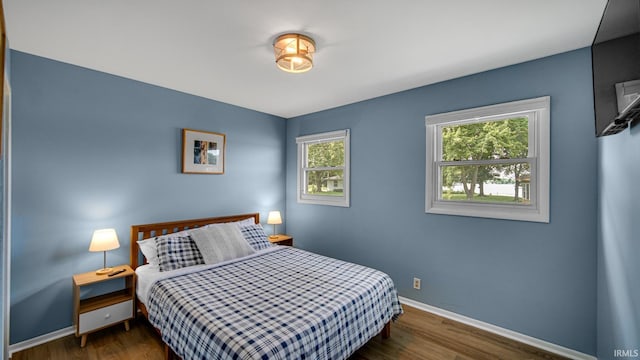 1897 Lakeshore Dr, Walkerton, IN 46574 - bedroom with dark wood-style floors