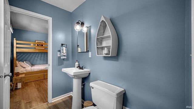 1897 Lakeshore Dr, Walkerton, IN 46574 - bathroom featuring wood finished floors and connected bathroom