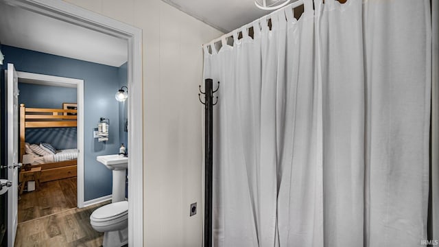 1897 Lakeshore Dr, Walkerton, IN 46574 - bathroom with wood finished floors, ensuite bath, and a shower with curtain