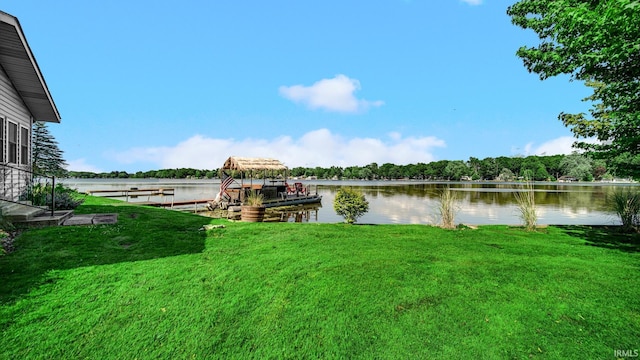 1897 Lakeshore Dr, Walkerton, IN 46574 - dock area with a lawn and a water view