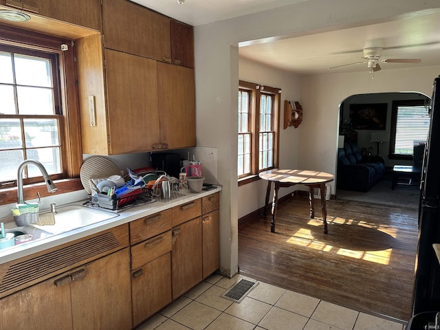 2816 E Morgan Ave, Evansville, IN 47711 - kitchen with light countertops, light tile patterned floors, healthy amount of natural light, and ceiling fan