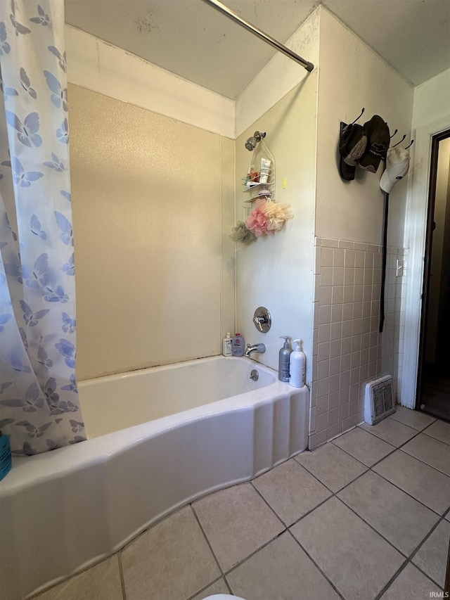 2816 E Morgan Ave, Evansville, IN 47711 - bathroom featuring tile patterned floors, shower / bath combo with shower curtain, and tile walls