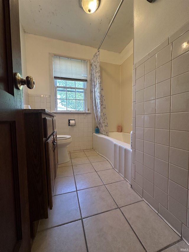 2816 E Morgan Ave, Evansville, IN 47711 - bathroom featuring tile walls, tile patterned floors, vanity, shower / bath combo with shower curtain, and a wainscoted wall