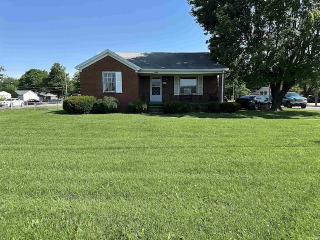 2816 E Morgan Ave, Evansville, IN 47711 - view of front of house featuring covered porch, brick siding, and a front yard