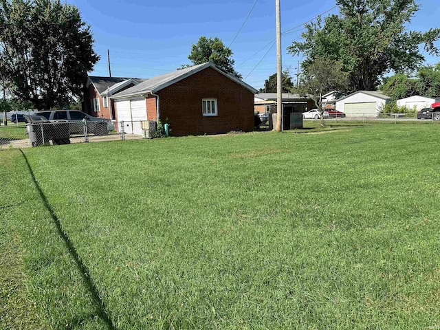 2816 E Morgan Ave, Evansville, IN 47711 - view of yard featuring an attached garage