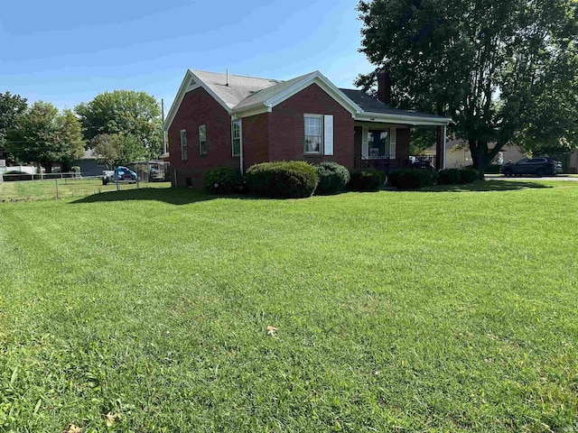 2816 E Morgan Ave, Evansville, IN 47711 - view of home's exterior with brick siding and a chimney