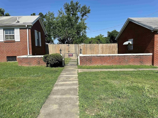 2816 E Morgan Ave, Evansville, IN 47711 - view of property exterior featuring brick siding and a gate