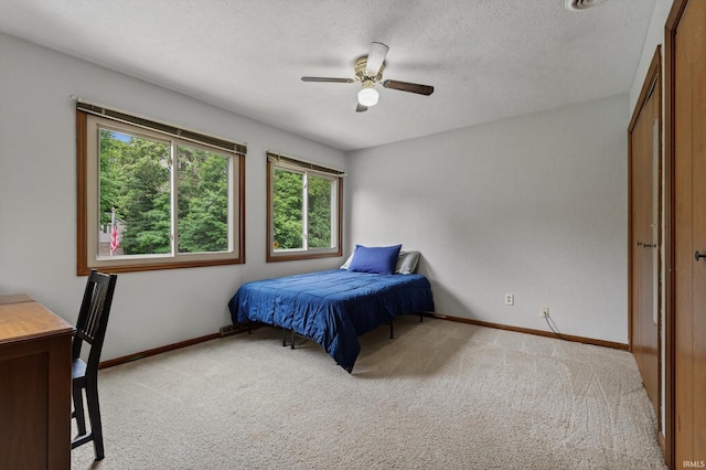 953 Handlebar Rd, Mishawaka, IN 46544 - bedroom featuring carpet, a textured ceiling, and ceiling fan