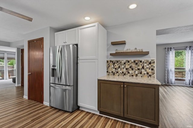 953 Handlebar Rd, Mishawaka, IN 46544 - kitchen featuring stainless steel fridge, wood finished floors, open shelves, backsplash, and white cabinetry