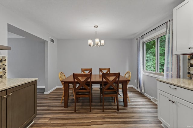953 Handlebar Rd, Mishawaka, IN 46544 - dining room with dark wood-type flooring and a chandelier