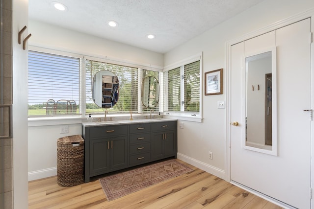 3865 E Forest Glen Ave, Leesburg, IN 46538 - full bathroom featuring double vanity, wood finished floors, recessed lighting, and a textured ceiling
