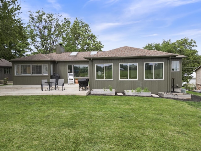 3865 E Forest Glen Ave, Leesburg, IN 46538 - rear view of property featuring a chimney, a lawn, a patio area, and a shingled roof