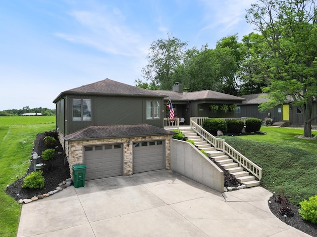 3865 E Forest Glen Ave, Leesburg, IN 46538 - view of front of property featuring stone siding, driveway, a front yard, an attached garage, and stairs