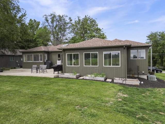 3865 E Forest Glen Ave, Leesburg, IN 46538 - back of property featuring a chimney, a yard, a patio, and roof with shingles
