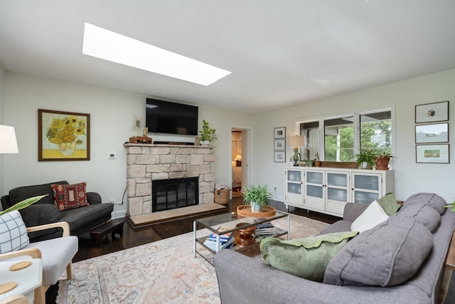 3865 E Forest Glen Ave, Leesburg, IN 46538 - living room featuring a skylight, wood finished floors, and a stone fireplace