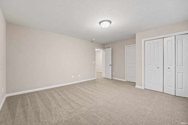 10263 Tirian Pl, Fort Wayne, IN 46835 - unfurnished bedroom featuring carpet floors, a textured ceiling, and a closet