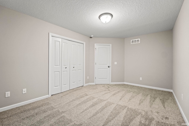 10263 Tirian Pl, Fort Wayne, IN 46835 - unfurnished bedroom featuring a closet, a textured ceiling, and carpet floors