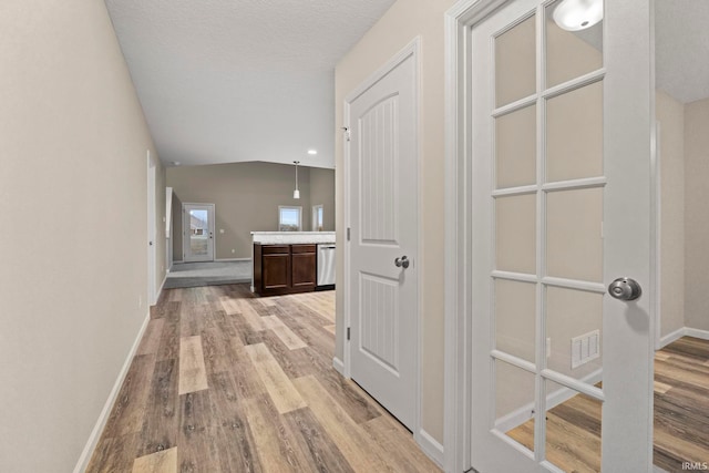 10263 Tirian Pl, Fort Wayne, IN 46835 - hallway featuring light wood-type flooring and vaulted ceiling