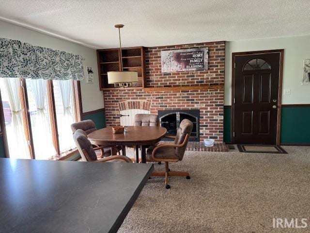 7737 N 100 E Rd, Lucerne, IN 46950 - dining room with a fireplace, a textured ceiling, and carpet