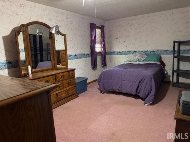 7737 N 100 E Rd, Lucerne, IN 46950 - carpeted bedroom with wallpapered walls and a textured ceiling