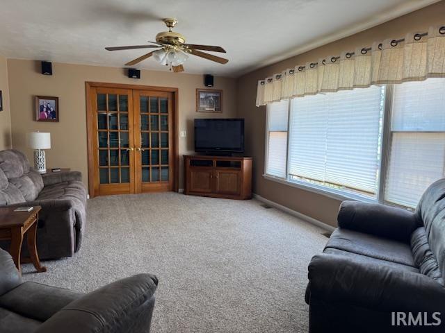 7737 N 100 E Rd, Lucerne, IN 46950 - living room with ceiling fan, french doors, and carpet