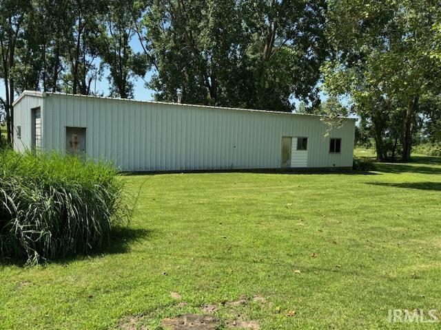 7737 N 100 E Rd, Lucerne, IN 46950 - view of green lawn with an outbuilding and an outdoor structure