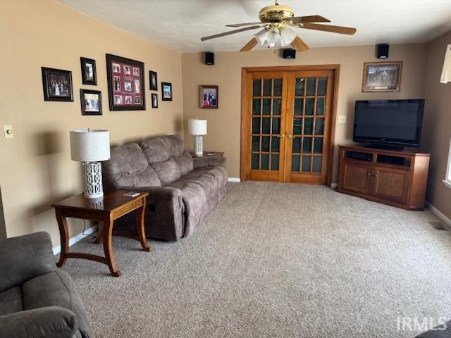 7737 N 100 E Rd, Lucerne, IN 46950 - living area with french doors, ceiling fan, and carpet floors